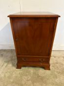 A mahogany veneer Hifi unit, single cupboard with drawer under (H74cm W49cm D47cm)