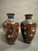 A pair of Cloisonne vases, brown grounds with a floral pattern