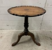 An oak topped pedestal table on turned central support on splayed legs (H53cm Dia45cm)