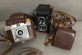 Two vintage cameras, a Halma 44 and a Silette peontor SVS