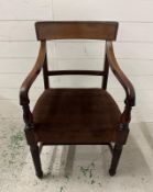 A mahogany Regency style chair with brown velvet seat