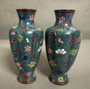 A pair of ribbed Cloisonne vases, blue grounds with a floral pattern
