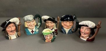 A selection of Royal Doulton character jugs to include Porthos, Lobster man and Athos