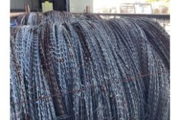 1 STILLAGE OF BRITISH ARMY CONCERTINA GALVANISED RAZOR WIRE IN BUNDLES UNISSUED