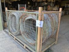 1 STILLAGE OF BRITISH ARMY CONCERTINA GALVANISED RAZOR WIRE IN BUNDLES UNISSUED