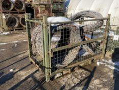 1 STILLAGE OF BRITISH ARMY CONCERTINA GALVANISED RAZOR WIRE IN BUNDLES UNISSUED