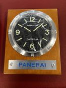 A Panerai wall clock LUMINOR, Switzerland, in wood/steel, quartz movement 