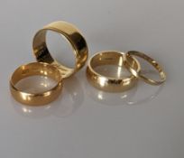 A 22ct yellow gold wedding band, 5mm, 5g; a 14ct gold wedding band, 2mm, 1g 