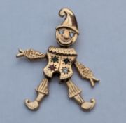 A 9ct yellow gold articulated clown pendant with diamond, ruby, sapphire and emerald decoration, 45m