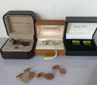 A pair of oval rose gold cufflinks; another pair in yellow gold, inscribed 2000