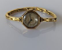 A 1920s ladies wristwatch with octagonal gold case, hallmarked 18ct,