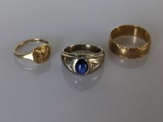 An oval blue star sapphire cabochon ring with diamond decoration on a 10k white gold setting