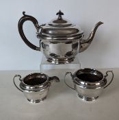 An Art Deco silver three-piece tea set with beaded decoration, hallmarked for William Adams