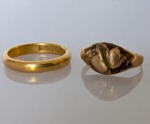 A 22ct yellow gold wedding band, hallmarked, 4.4g and a 9ct gold signet ring with oak leaf design