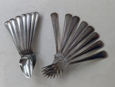 A set of seven early 20th century Dutch silver forks and six silver spoons, each 18.5 cm