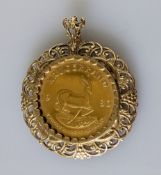 A 1 oz fine gold Krugerrand, 1980, in a pierced 9ct gold mount, hallmarked, 44.3g