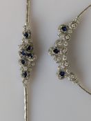 A sapphire and diamond necklace on a white gold setting comprising an integrated pendant 