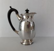 A late Victorian silver hot water lidded jug, hallmarked, Birmingham, 1901