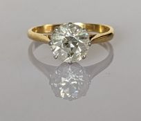 An old brilliant-cut diamond solitaire ring on an 18ct yellow gold and platinum claw setting