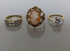An oval cameo ring on an elaborately pierced, claw-set mount, stamped and tests for 14ct gold