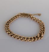 A 9ct rose gold flat curb-link bracelet, each link stamped, 15 cm, 10.5g