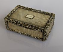 A Victorian silver gilt table oblong snuff box with applied carved border, engine turned all around