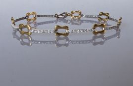 A white and yellow gold fancy-link bracelet with lobster clasp, 18 cm, tests for 18ct gold, 9g
