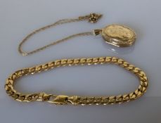 An Italian yellow gold flat curb-link bracelet with a lobster clasp, 19 cm and an oval yellow gold