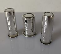 A contemporary silver cruet set is the form of bullets, hallmarked for Garrard & Co Ltd., Birmingham