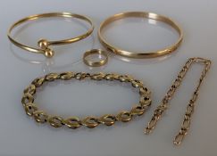 Two 9ct yellow gold bangles, one stamped, the other testing for 9ct, both 65mm