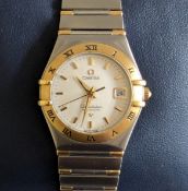 A ladies Omega Constellation Automatic 18ct gold and steel wristwatch with white dial