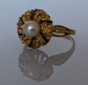 A pearl dress ring with blue enamel decoration on a yellow gold setting, stamped 750, size S, 6.6g