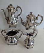 A Victorian silver four-piece tea and coffee service of baluster form with C-scroll embossed 