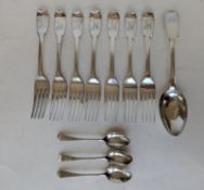 A set of seven Georgian silver fiddle pattern dinner forks