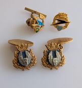 A pair of gold cufflinks with BOAC insignia together with two gold badges commemorating BOAC