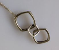 A Tiffany & Co Frank Gehry designed triple torque silver pendant chain, with original packaging