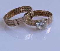Two yellow gold wedding bands with carved decoration, one with a mounted cubic zirconia, size R, P,