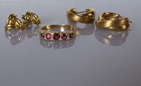 A ruby and gold ring, the five graduated stones on a carved setting, hallmarked 18ct, size Q