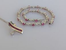 The Diamond Store: a ruby and diamond line or tennis bracelet on a white gold claw setting, 19 cm