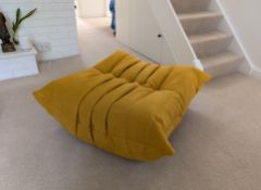 A Ligne Roset Togo footstool in Alcantara curry fabric with original wrapping, as new, 34 x 87 x 80 