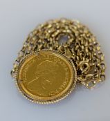 A QEII half gold sovereign, 1982, on a 9ct gold mount and belcher chain, 11.5g