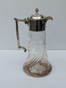 An Edwardian silver mounted glass claret jug,  the lid with moulded finial and gadroon rim, angular 