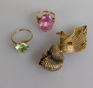 A yellow gold and ruby knot brooch, 60mm, unmarked but test for 9ct gold