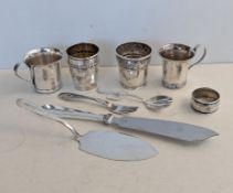 Four Danish silver beakers, a Georg Jensen silver fork, pattern 42 with pierced handle, 14.5 cm, imp