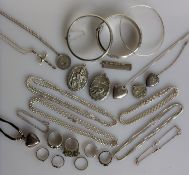 An assortment of silver based jewellery to include pendants, pendant chains, bangles, bracelets, 