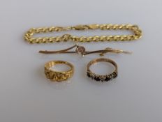 A late Victorian 18ct yellow gold carved ring, size J 1/2, hallmarked; an Edwardian 15ct brooch 
