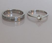A platinum half-hoop eternity diamond ring with channel-set diamonds, each approximately 0.02 carats