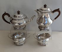 A George V silver four-piece tea and coffee service of squat form, gadrooned rims