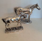 A sterling silver filled model of a horse on an oval base, 27 x 24 cm (including base) and another