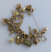 A 9ct yellow gold charm bracelet, 68.5g